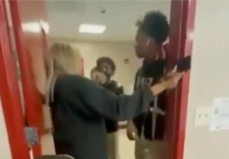 Student Punches Teacher In The Face After She Slams Door On His Hand!