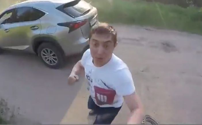Road Rager Gets His Ass Whooped While His Car Slowly Drifts Down The Road!